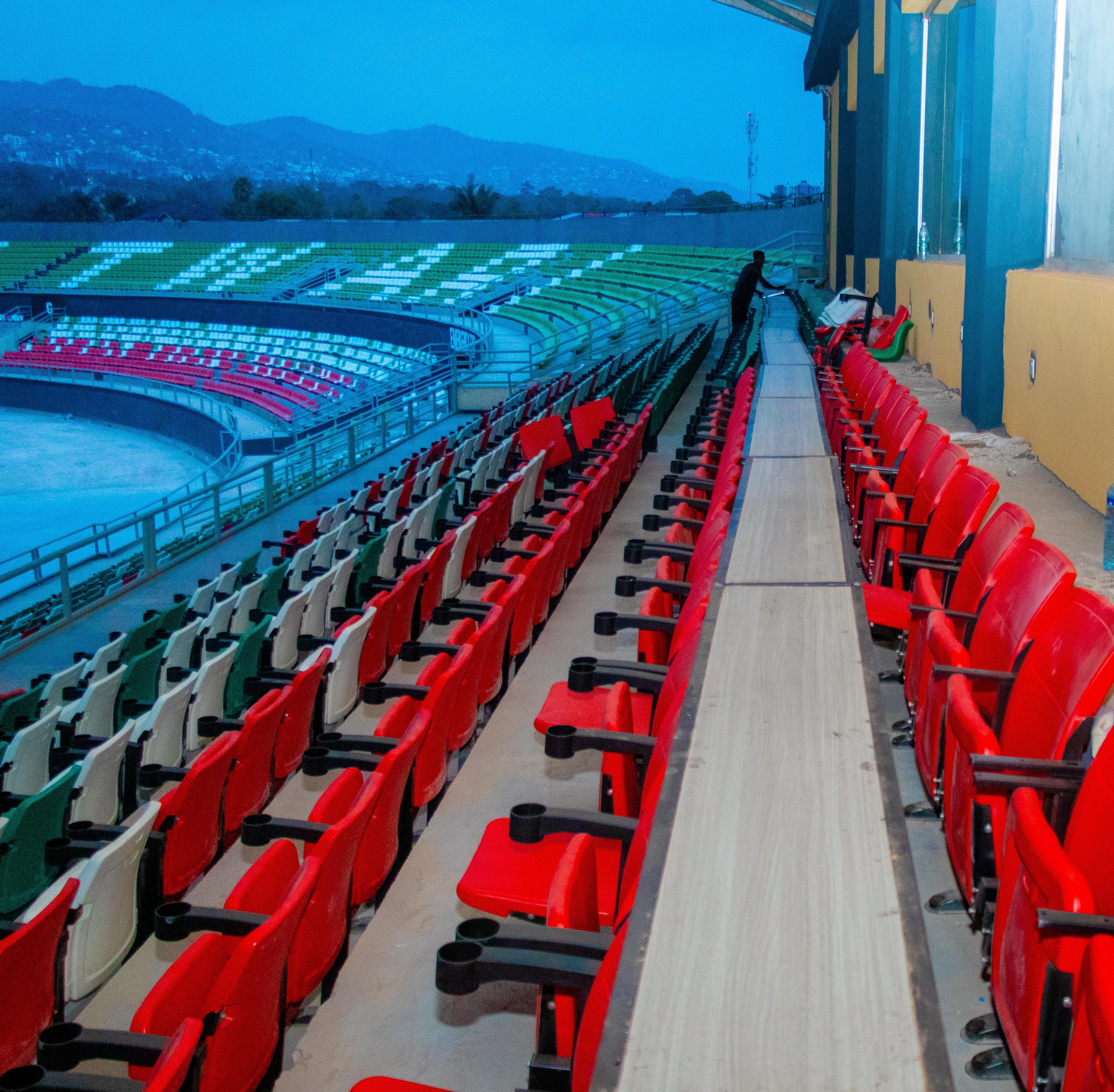 Grandstand seating at Stade Ntwari at blue hour